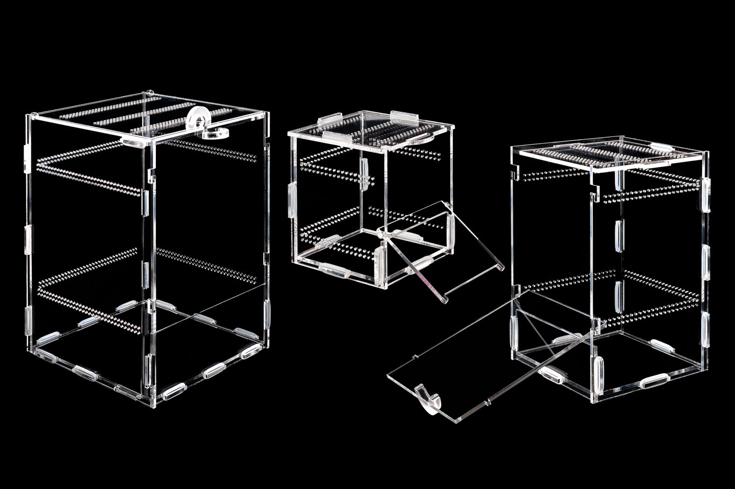 Image shows three acrylic enclosures of various sizes. Two front-opening and one top-opening 